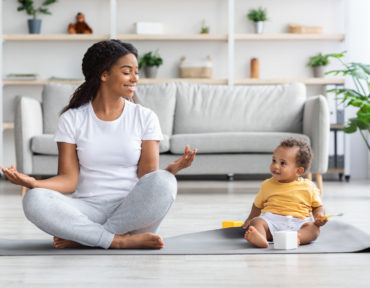 Trainings With Baby. Black Mother And Toddler Son Practicing Yoga At Home